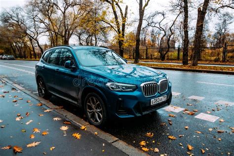 Front Side View Of Blue Crossover BMW X3 Parked Along The Street Car