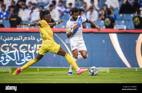 Yasser Alshahrani Of Al Hilal SFC And 11 Mohamed Al Thani Of Al Hazem