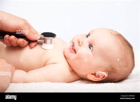 Pediatrician Examines Three Month Baby Girl Doctor Using A Stethoscope