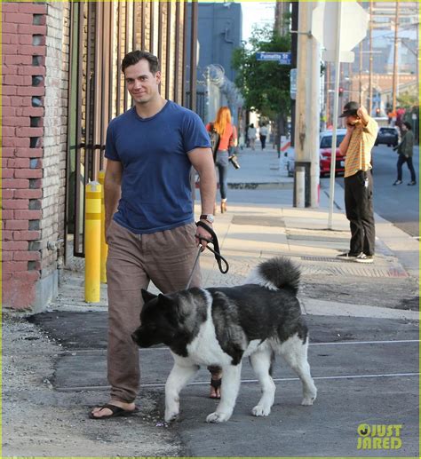 Henry Cavill Shows Off Buff Biceps Taking His Dog For A Walk Photo