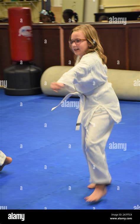 This action photo is of my daughter in her Karate class. Karate is a ...