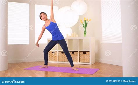 Chinese Woman Doing Yoga Pose Extended Side Angle Stock Video Video