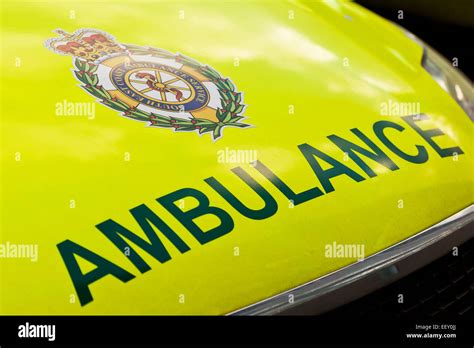 AMBULANCE logo on the front of an ambulance vehicle (UK Stock Photo - Alamy