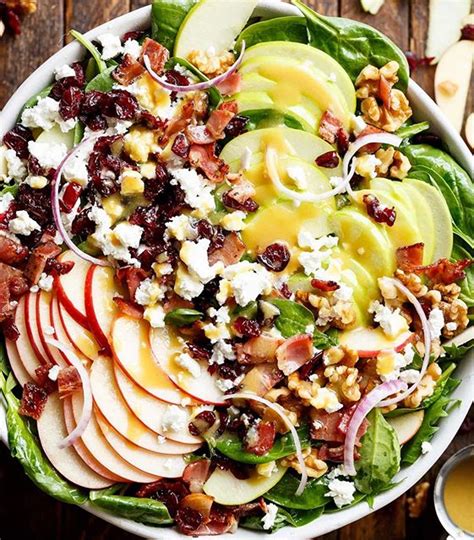 Spinach Salad With Bacon Apples Dried Cranberries Walnuts And Honey Dijon Dressing By