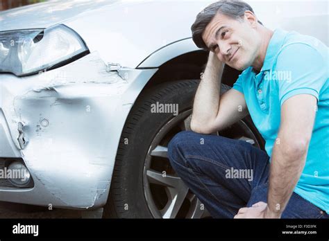 Unhappy Driver Inspecting Damage After Car Accident Stock Photo Alamy