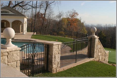 Metal Pool Fence And Gate With Stone Pillars