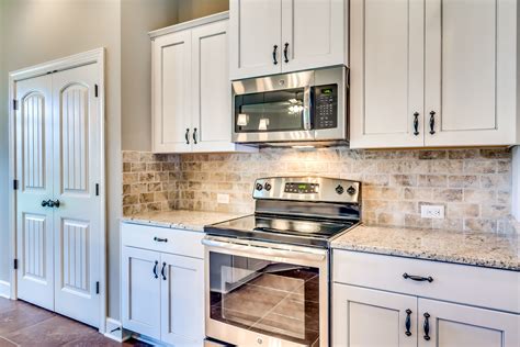 Beautiful Kitchen With Stainless Steel Appliances Granite Countertops And Off White Custom