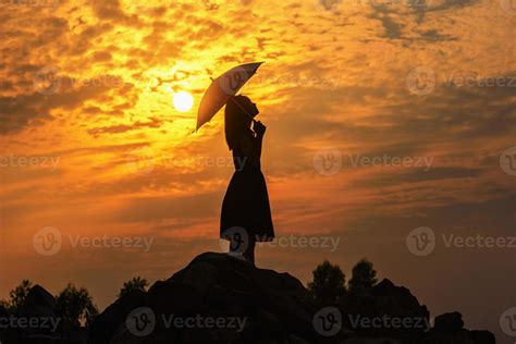 Silhouette sad girl at sunset. 13310613 Stock Photo at Vecteezy