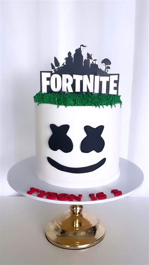 A Cake That Has Been Decorated To Look Like A Fortnite Hat On Top