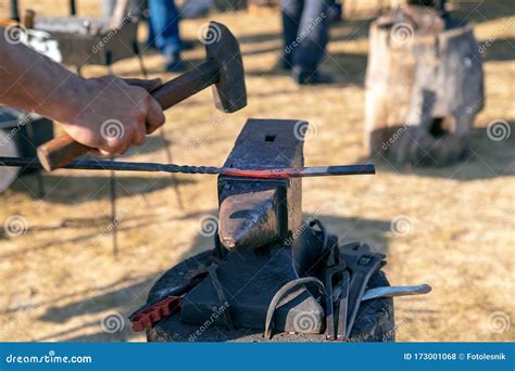 Rustic Blacksmith Forges Hot Metal Product On The Anvil Production Metal Products Manually
