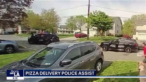 Moment takeaway delivery driver clutching pizza trips up suspect in police chase | indy100