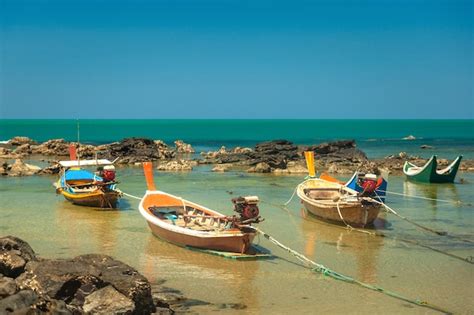 Premium Photo Colorful Wooden Thai Style Fishing Boats Stand Among