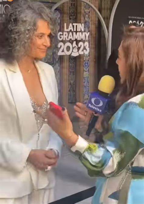 A Woman Talking To An Interviewer On The Red Carpet