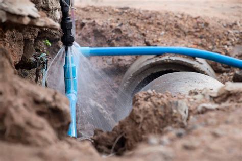 Water Pipe Break Exposing A Burst Water Main Focused On The Spraying