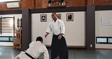 Karate Class Or People Learning Martial Arts In Dojo For Fitness