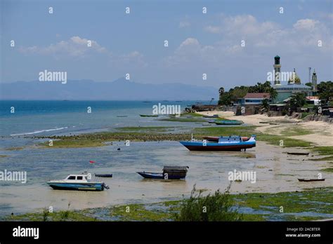 Indonesia Kupang City Coastline With Fishing Boats And Mosque Nurul