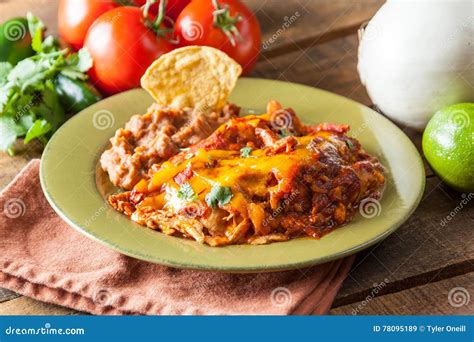 Chicken Enchilada Mexican Food Casserole Served On Rusitc Green Stock