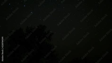 Starry night sky. Twinkling stars in the dark night sky. Time lapse ...