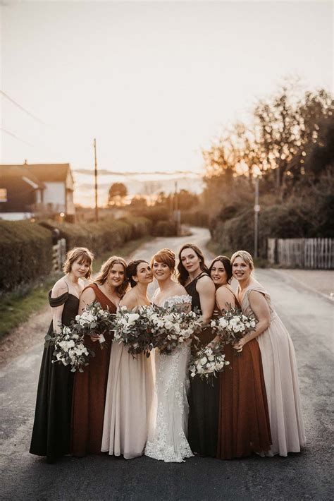 Bridesmaids In Brown Rust And Cream Coloured Dresses With Various