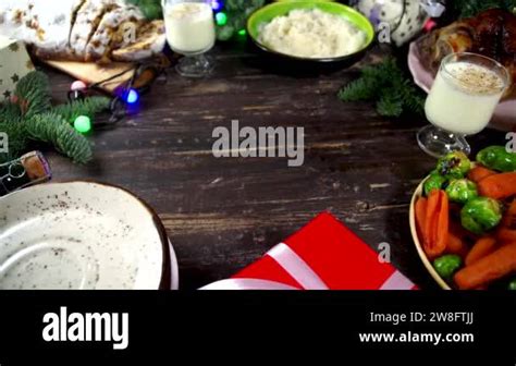 Festive Christmas Dinner Table With Traditional Foods And Dished Baked