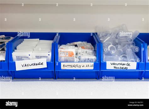 Plastic Tubs Containing Medical Equipment Including Butterfly Needles