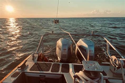 Ferry And Coast Guard Crews Assist Three When Sailboat Flips Near