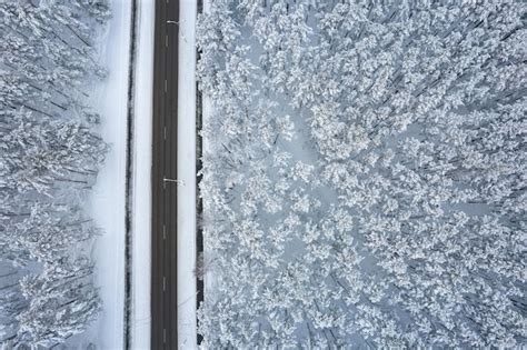 Premium Photo Aerial View Of Asphalt Highway Leading Through Frosty