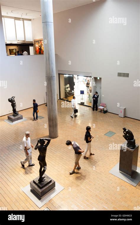 Visitors Look At Sculptures At The National Museum Of Western Art In