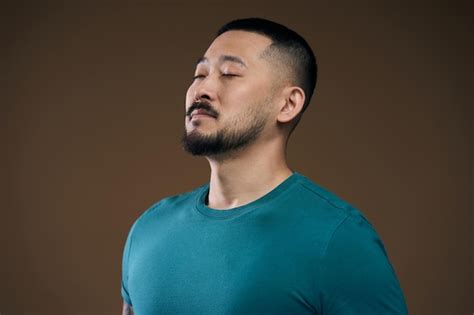 Premium Photo Portrait Of Handsome Asian Bearded Man In Green Tshirt