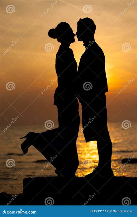 Silhouette of Romantic Couple on the Beach at Sunset Stock Image ...