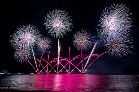 Amazing Beautiful Colorful Fireworks Display On Celebration Night Showing On The Sea Beach With