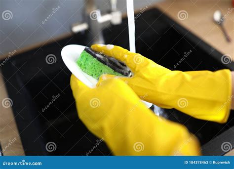 Gloved Hands Wash Dishes Under Tap With Sponge Stock Image Image Of