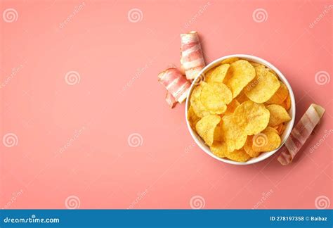 Bowl Of Crispy Potato Chips Or Crisps With Bacon Flavor On Pink