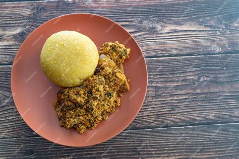 Premium Photo Nigerian Egusi Melon Soup With Garri Eba For Lunch