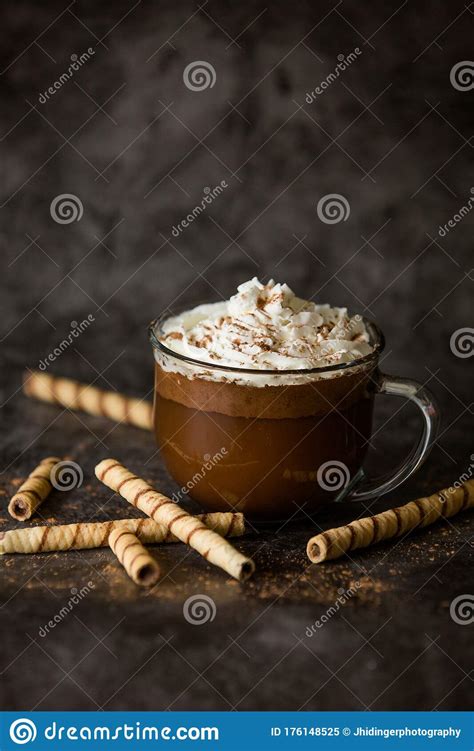 Gourmet Hot Chocolate In Glass Mug With Whipped Cream On A Dark