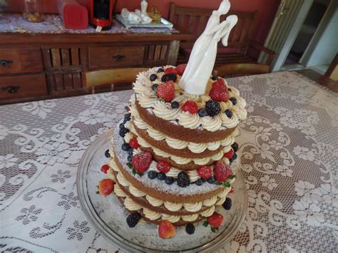 Wedding Cake In A Naked Cake Style Decorated With White Chocolate Cream