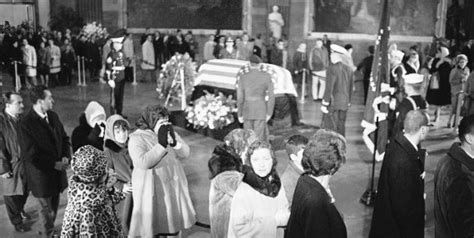 Mourners File Past The Bier Of President John F Kennedy In The Capitol Rotunda In Washington D