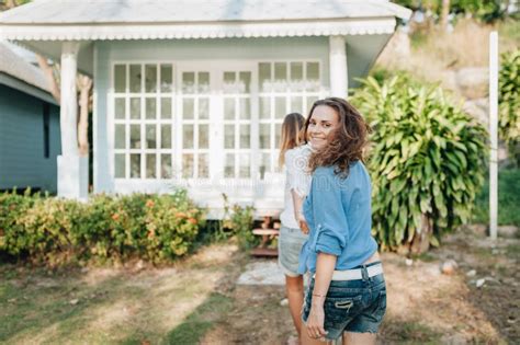 Happy Lesbian Couple Walking In The Garden At Their Country House Stock Image Image Of Hotel