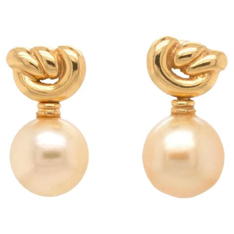 Golden Cultured Pearl And 18 Carat Yellow Gold Love Knot Dangle