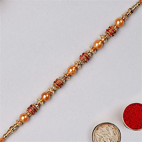 Golden Red Pearl Thread Rakhi Singapore Gift Golden Red Pearl Thread