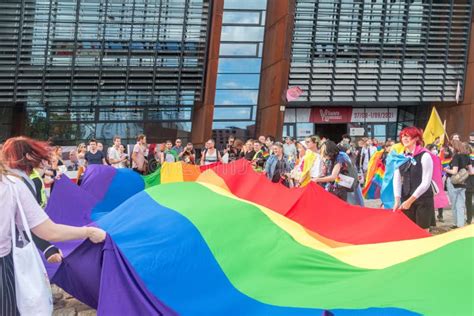 People Hold A Huge Rainbow Flag At Gay Pride Parade Editorial