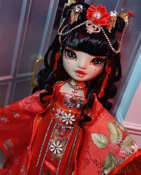 A Doll With Black Hair Wearing A Red Dress