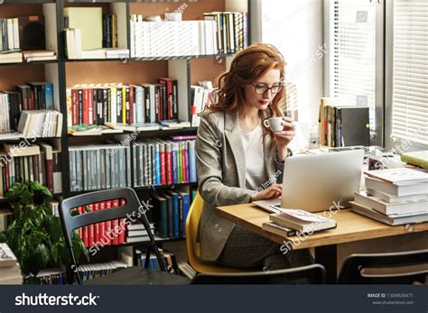 Female University Professor Preparing Class Using Stock Photo