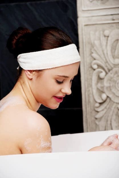 Premium Photo Woman Taking Bath In Tub