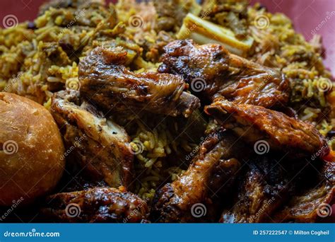 Jamaican Jerk Chicken Wings Curried Goat And Fried Dumpling With Rice