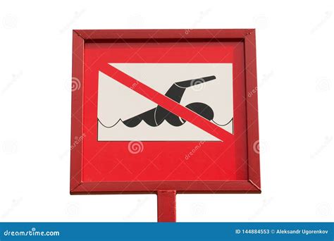 Do Not Swim Sign Board Is On The Sand Beach With A Small Red Flag And Deep Blue Sea Stock