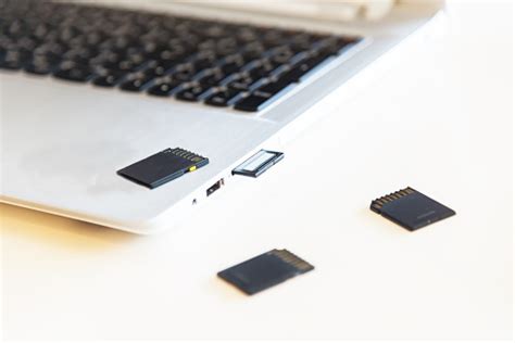 Hand Inserting Sd Card Into Laptop Slot Stock Photo Download Image