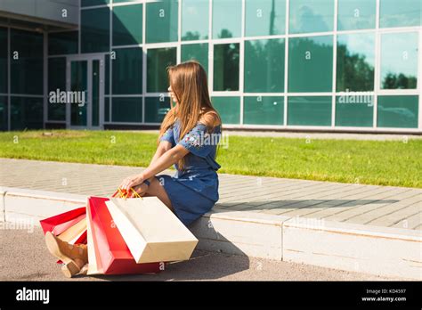 After Day Shopping Close Up Of Young Woman Carrying Shopping Bags While Walking Along The