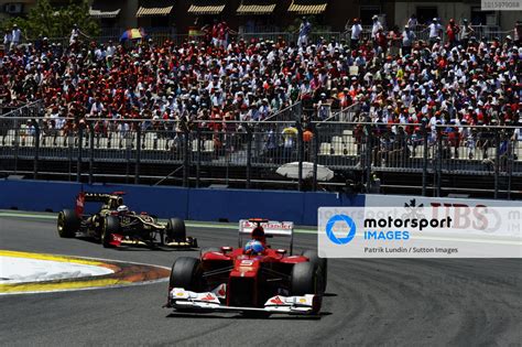 Fernando Alonso ESP Ferrari F2012 Leads Kimi Raikkonen FIN Lotus