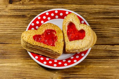 Heart Shaped Puff Cookies With Jam On Wooden Table Dessert On